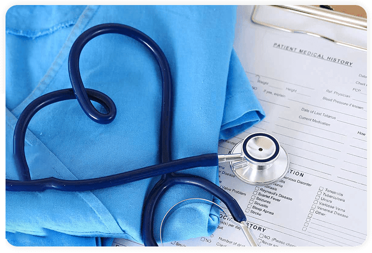 A healthcare products stethoscope sits on top of a medical document.