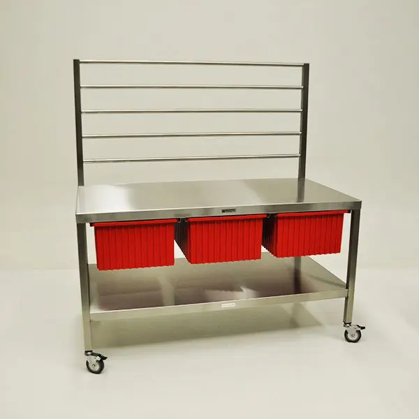 A table with three red drawers on it.