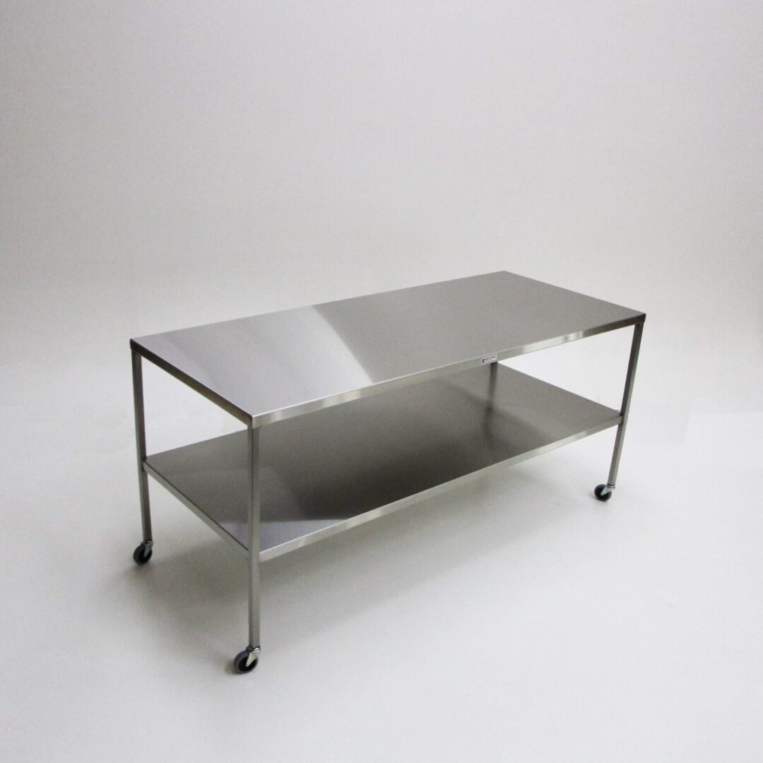A metal table with wheels on the bottom shelf.