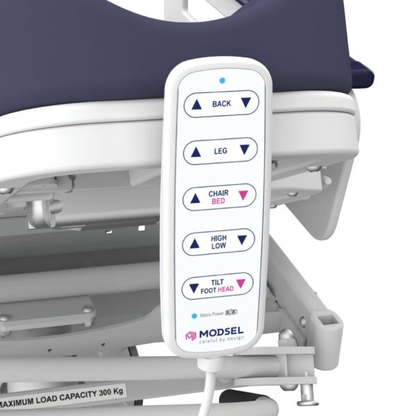 A remote control is attached to the back of a hospital bed.