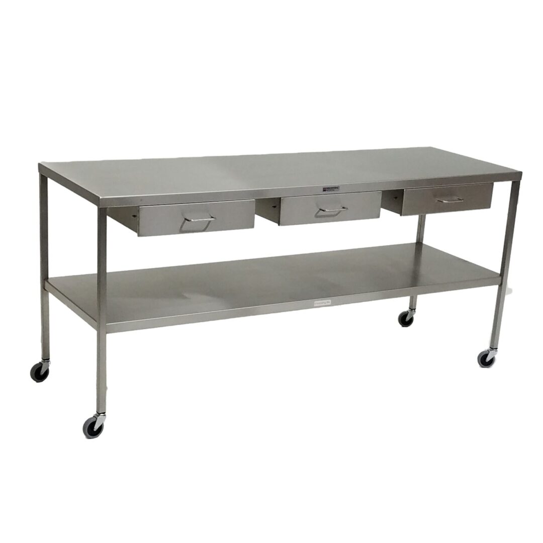 A metal table with three drawers and two shelves.