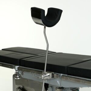 A close up of the surgical table with two black handles.