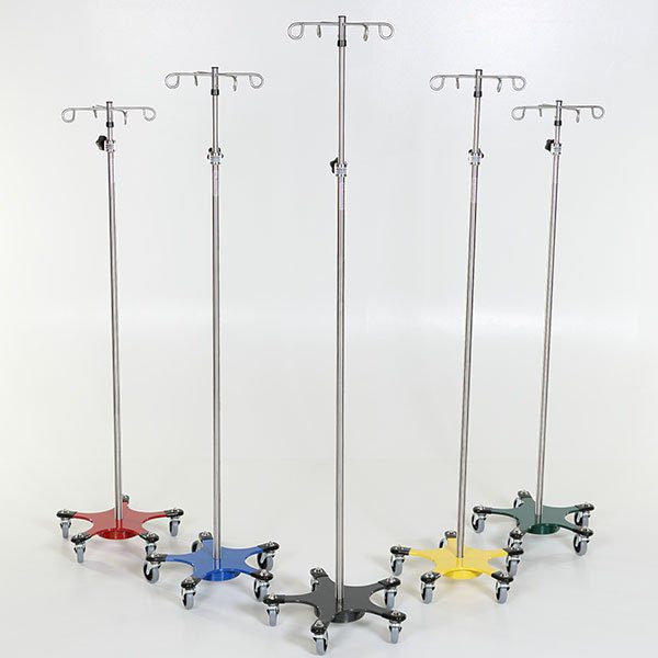 A group of five different colored stands with wheels.