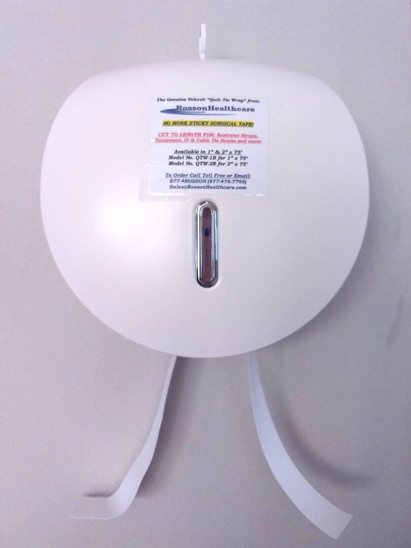 A white round shaped device with a thermometer on it.