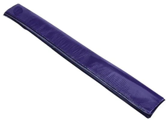 A purple strip of plastic is laying on the ground.