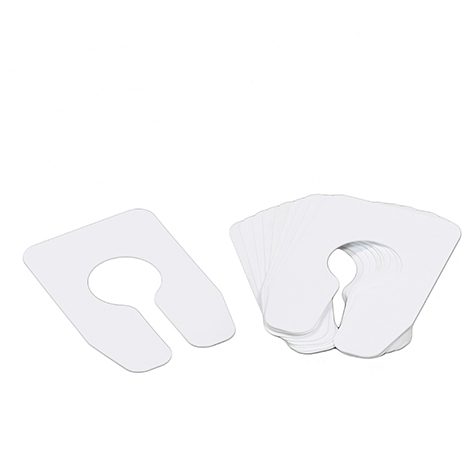 A set of four pairs of white plastic shoe covers.