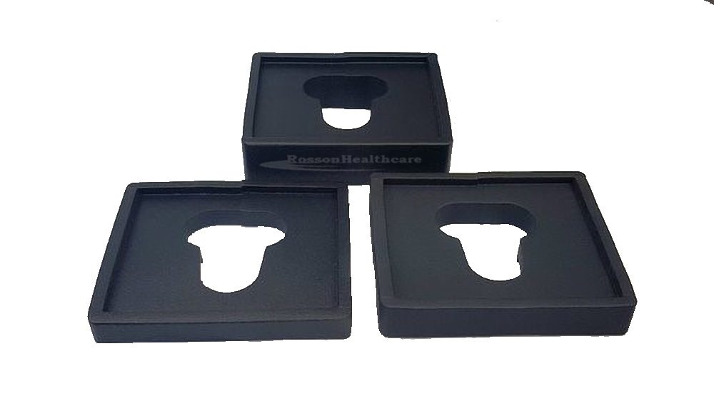 A set of three black trays with a bottle opener.